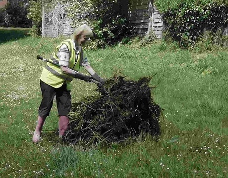 Christine piling up removed vegetation Christine piling up removed vegetation